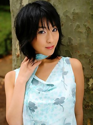 Alluring asian beauty intices with her big boobs and little dress