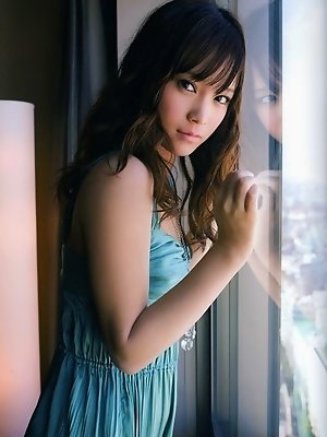 Beautiful gravure idol dressed in a bright and colorful kimono